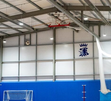 Featured interior image for Queen Elizabeth's Grammar School Sports Hall. Modern steel frame building fitted out with sports equipment.